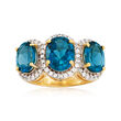 6.70 ct. t.w. London Blue Topaz and .90 ct. t.w. White Topaz Three-Stone Ring in 18kt Gold Over Sterling