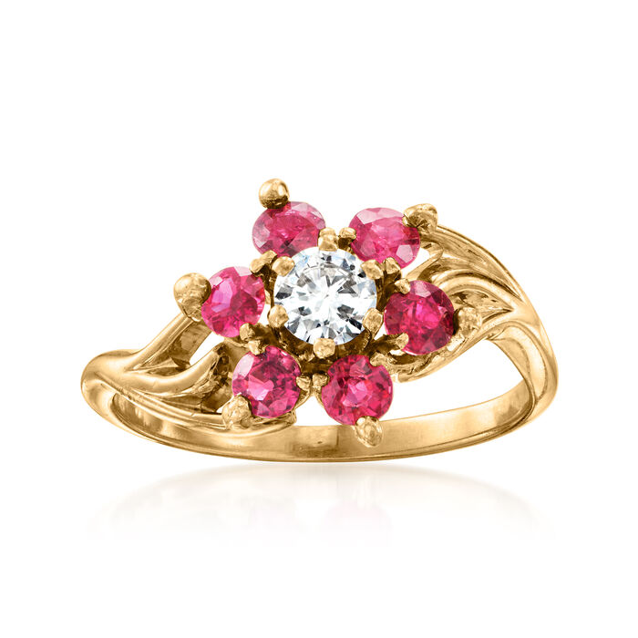 C. 1980 Vintage .25 Carat Diamond and 1.00 ct. t.w. Ruby Flower Ring in 14kt Yellow Gold