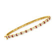 .60 ct. t.w. Ruby and .36 ct. t.w. Diamond Bangle Bracelet in 14kt Yellow Gold
