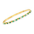C. 1980 Vintage 1.40 ct. t.w. Emerald and .60 ct. t.w. Diamond Bangle Bracelet in 18kt Yellow Gold