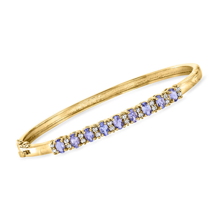 C. 1980 Vintage 3.00 ct. t.w. Tanzanite and .60 ct. t.w. Diamond Bangle Bracelet in 14kt Yellow Gold