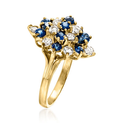 C. 1980 Vintage 1.20 ct. t.w. Sapphire and .80 ct. t.w. Diamond Cluster Ring in 14kt Yellow Gold
