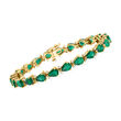 C. 1980 Vintage 10.50 ct. t.w. Emerald and .33 ct. t.w. Diamond Tennis Bracelet in 14kt Yellow Gold