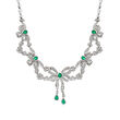 C. 1980 Vintage 6.00 ct. t.w. Diamond and 2.05 ct. t.w. Emerald Bow Necklace in 18kt White Gold