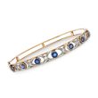 C. 1900 Vintage 1.80 ct. t.w. Sapphire and .20 ct. t.w. Diamond XO Bangle Bracelet in 14kt Yellow Gold