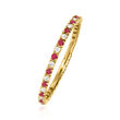 .18 ct. t.w. Ruby and .13 ct. t.w. Diamond Eternity Band in 14kt Yellow Gold
