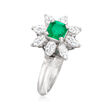 C. 1980 Vintage .50 Carat Emerald and .70 ct. t.w. Diamond Flower Ring in Platinum