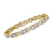 C. 1980 Vintage 6.00 ct. t.w. Tanzanite and 1.20 ct. t.w. Diamond Link Bracelet in 14kt Yellow Gold