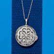 .10 ct. t.w. Diamond Floral Round Locket Necklace in Sterling Silver