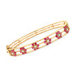 C. 1950 Vintage 2.15 ct. t.w. Ruby and .25 ct. t.w. Diamond Flower Bangle Bracelet in 14kt Yellow Gold