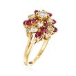 C. 1980 Vintage 1.30 ct. t.w. Diamond and 1.00 ct. t.w. Ruby Swirl Ring in 14kt Yellow Gold