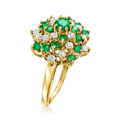 C. 1980 Vintage .85 ct. t.w. Emerald and .75 ct. t.w. Diamond Swirl Ring in 14kt Yellow Gold