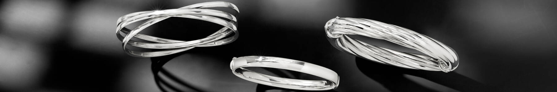 image featuring three sterling silver bangle bracelets