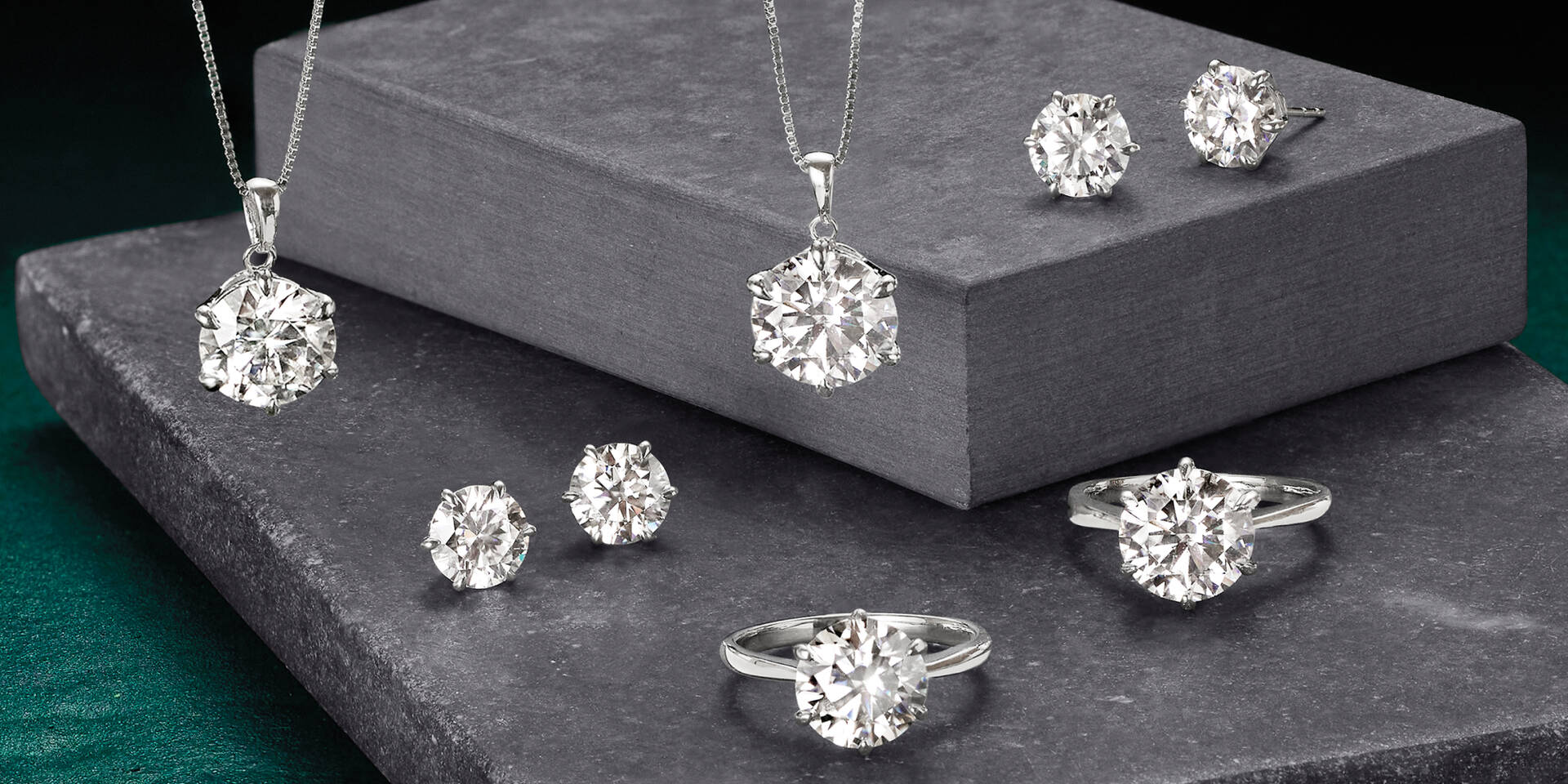 solitaire pendant, rings and stud earrings made of moissanite