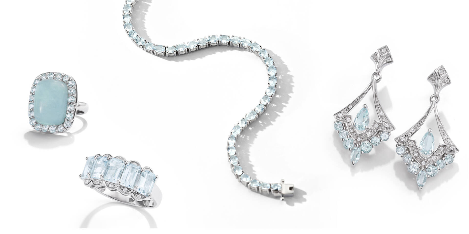 aquamarine earrings, necklace, and rings