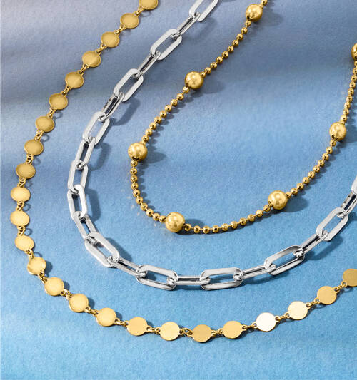three types of gold and silver necklaces
