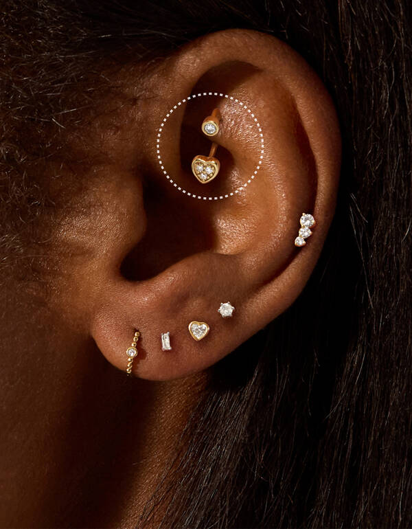 image featuring a model wearing a Rook gold hoop earring