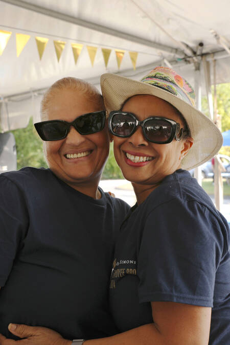 Two call center employees enjoying annual summer cookout