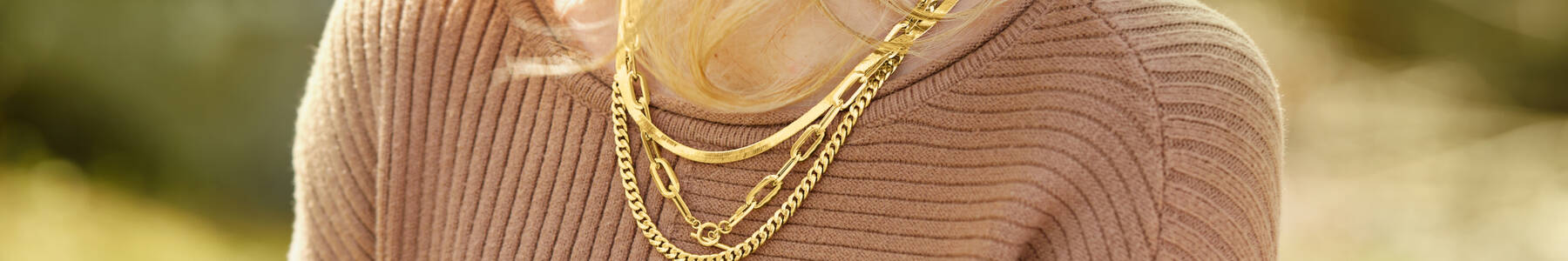 Gold Chain necklaces on a model