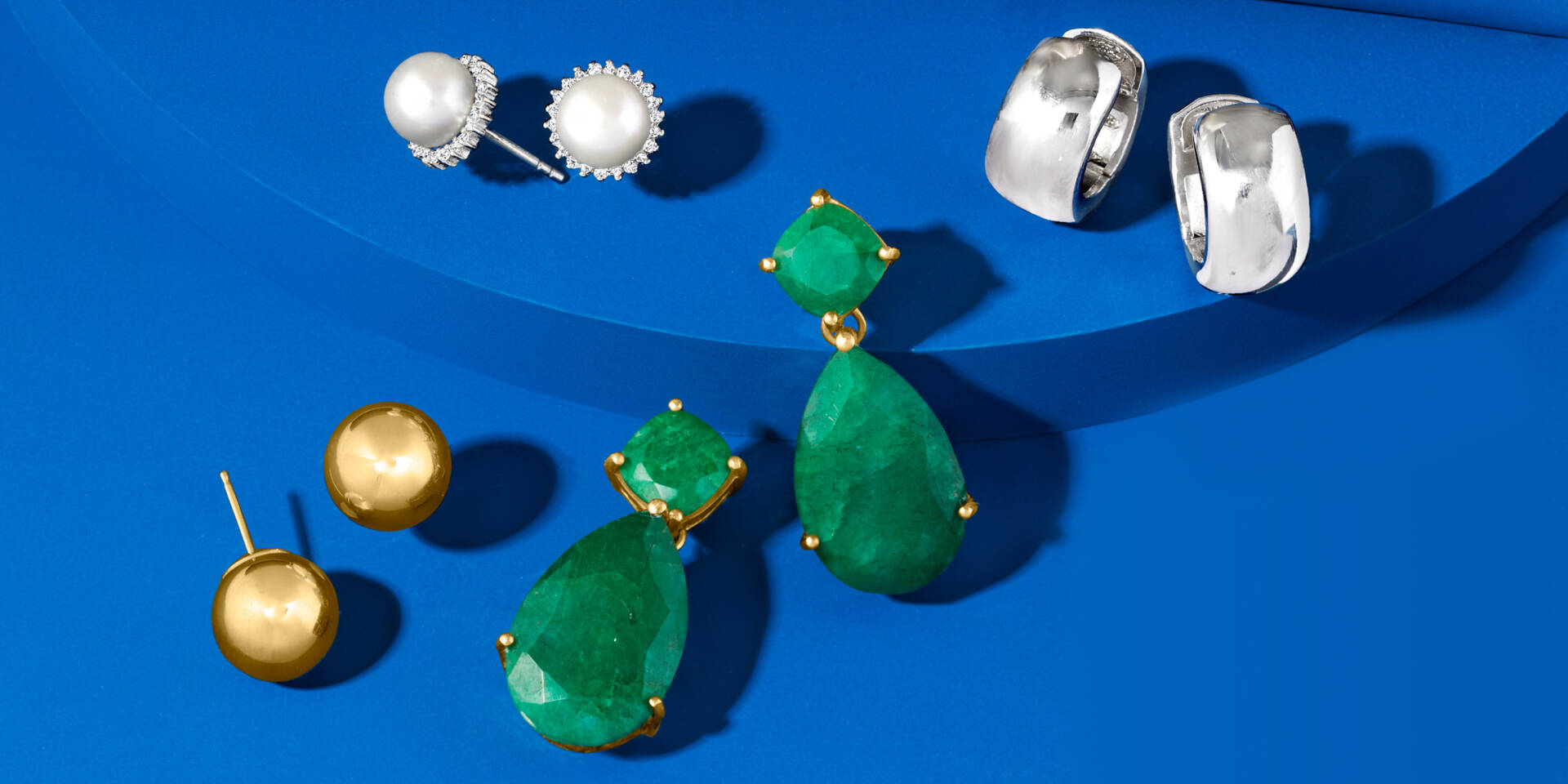 assortment of earrings, emerald, silver, pearl, gold