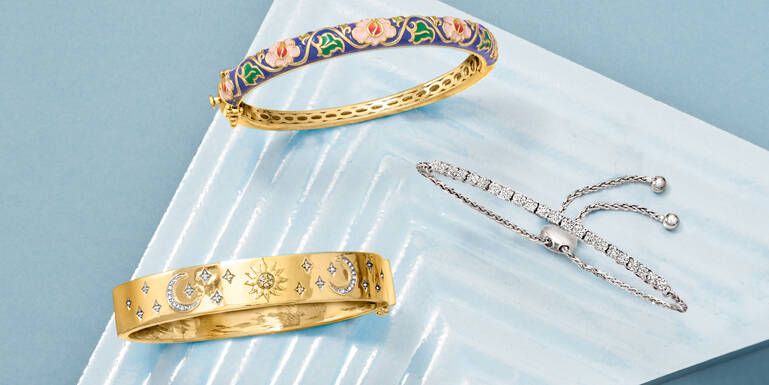 Woman Holding a Gift and Wearing Many Different Rings