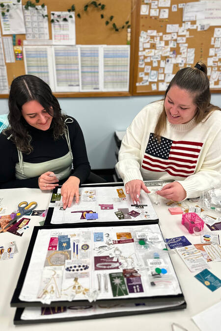 Merchants going over catalog spreads