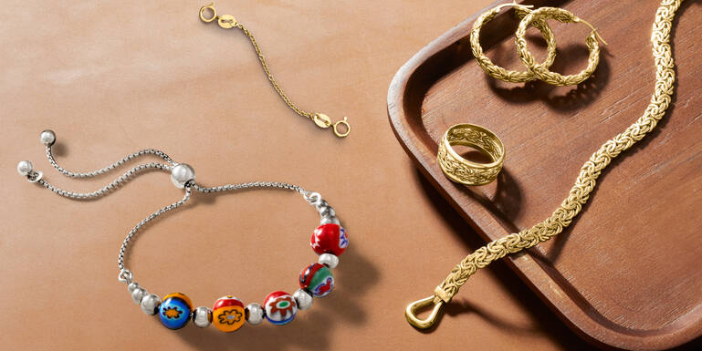 Woman Holding a Gift and Wearing Many Different Rings