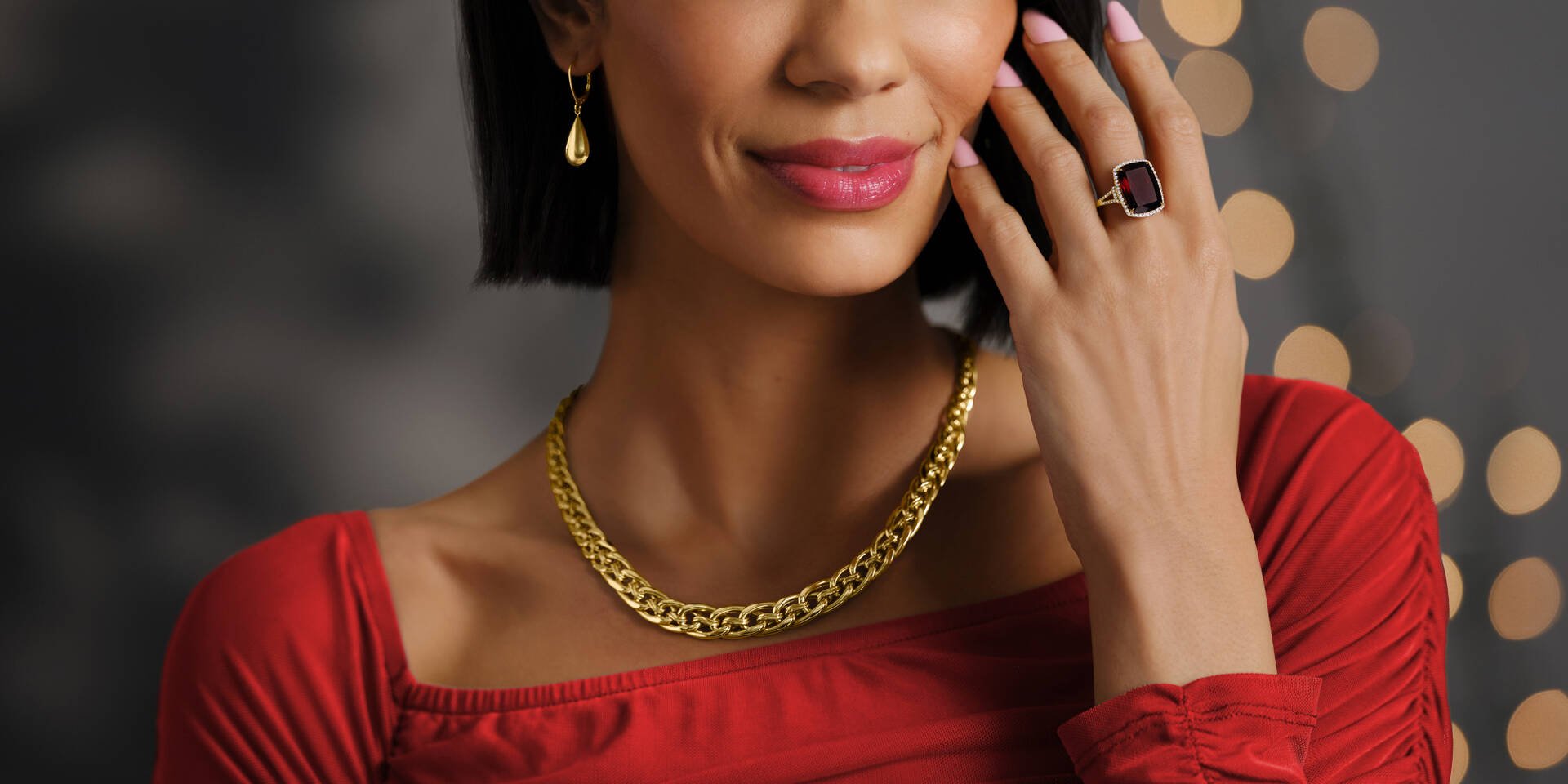 women wearing ring, necklace, and earrings