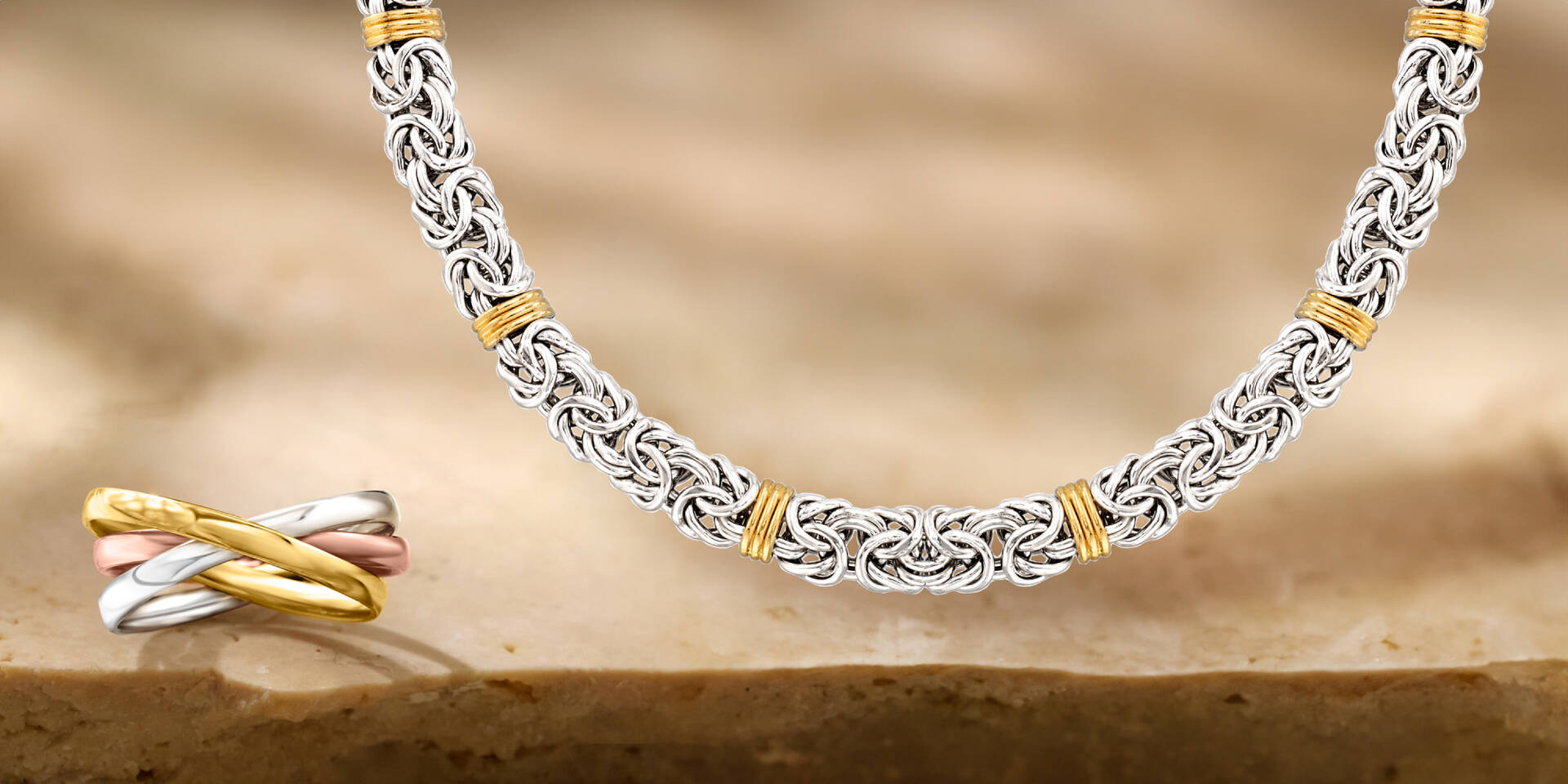 white and yellow metal necklace and ring