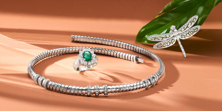 Woman Holding a Gift and Wearing Many Different Rings