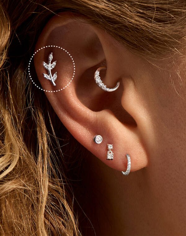 image featuring a model wearing a Helix gold hoop earring