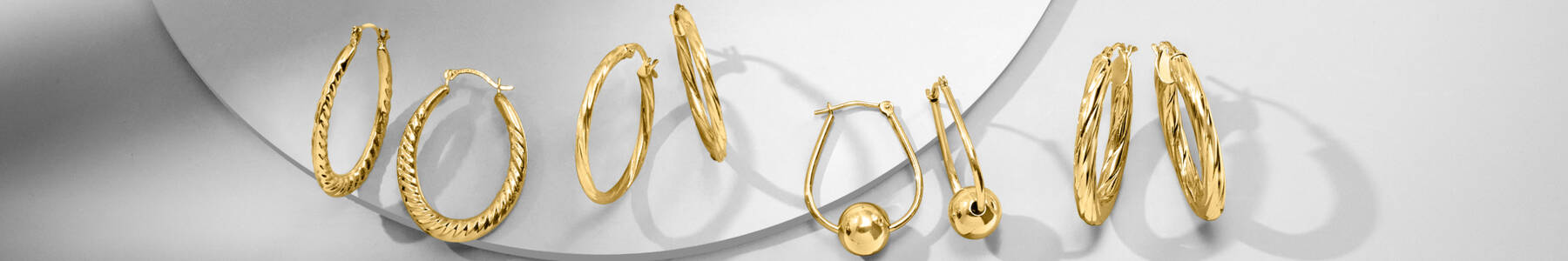 image featuring 4 sets of Gold Hoop earrings