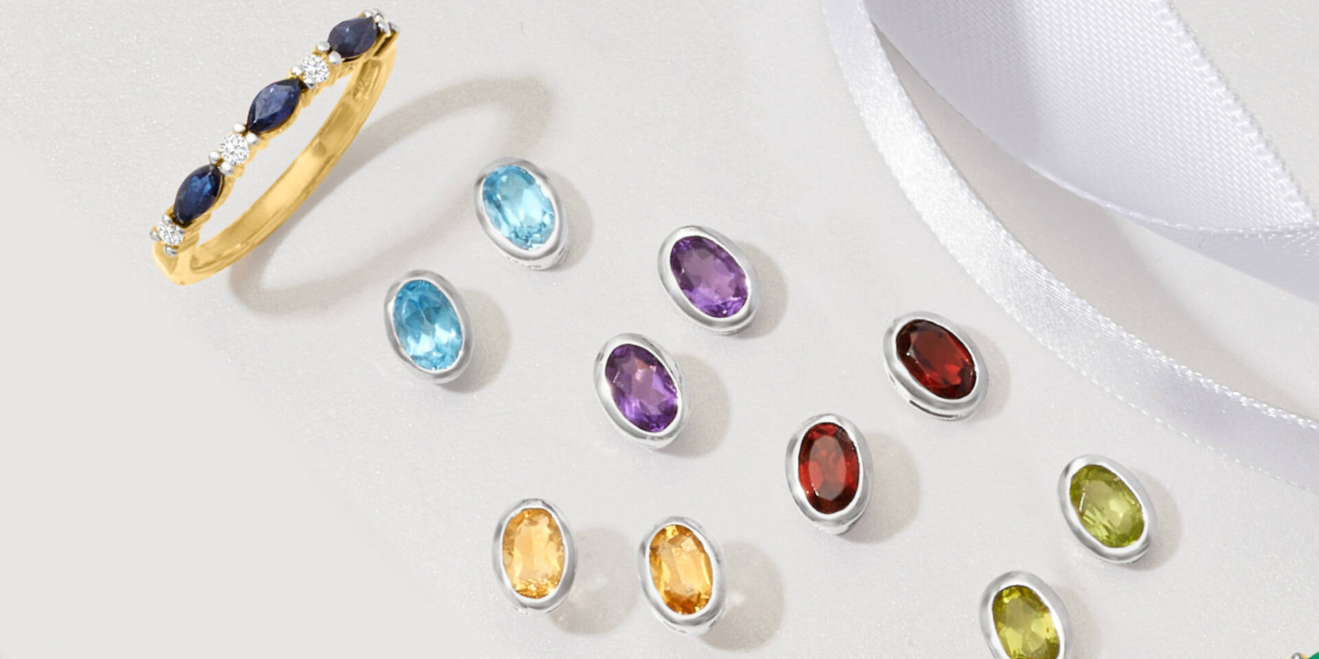 5 pairs of colored gemstone earrings and sapphire ring