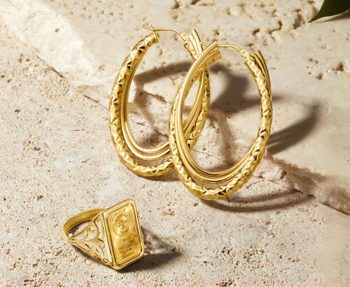 image featuring Italian gold hoop earring and a gold ring