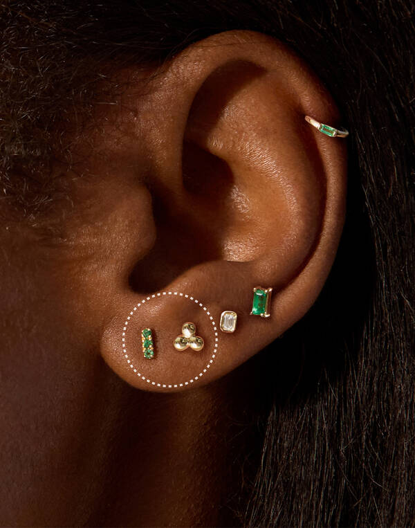 image featuring a model wearing a Lobe gold hoop earring