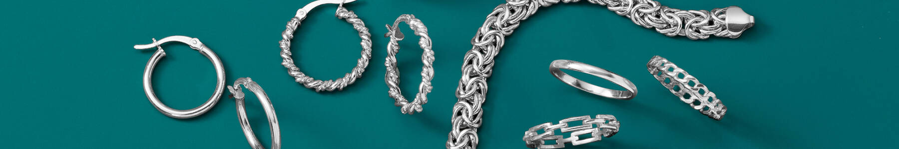 Sterling Silver Jewelry on green background