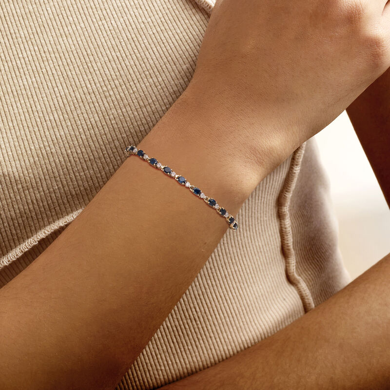 C. 2000 Vintage 5.00 ct. t.w. Sapphire Bracelet with .15 ct. t.w. Diamonds in 14kt Yellow Gold. 7" image number 1