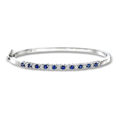C. 1990 Vintage .70 ct. t.w. Sapphire and .50 ct. t.w. Diamond Bangle Bracelet in 14kt White Gold