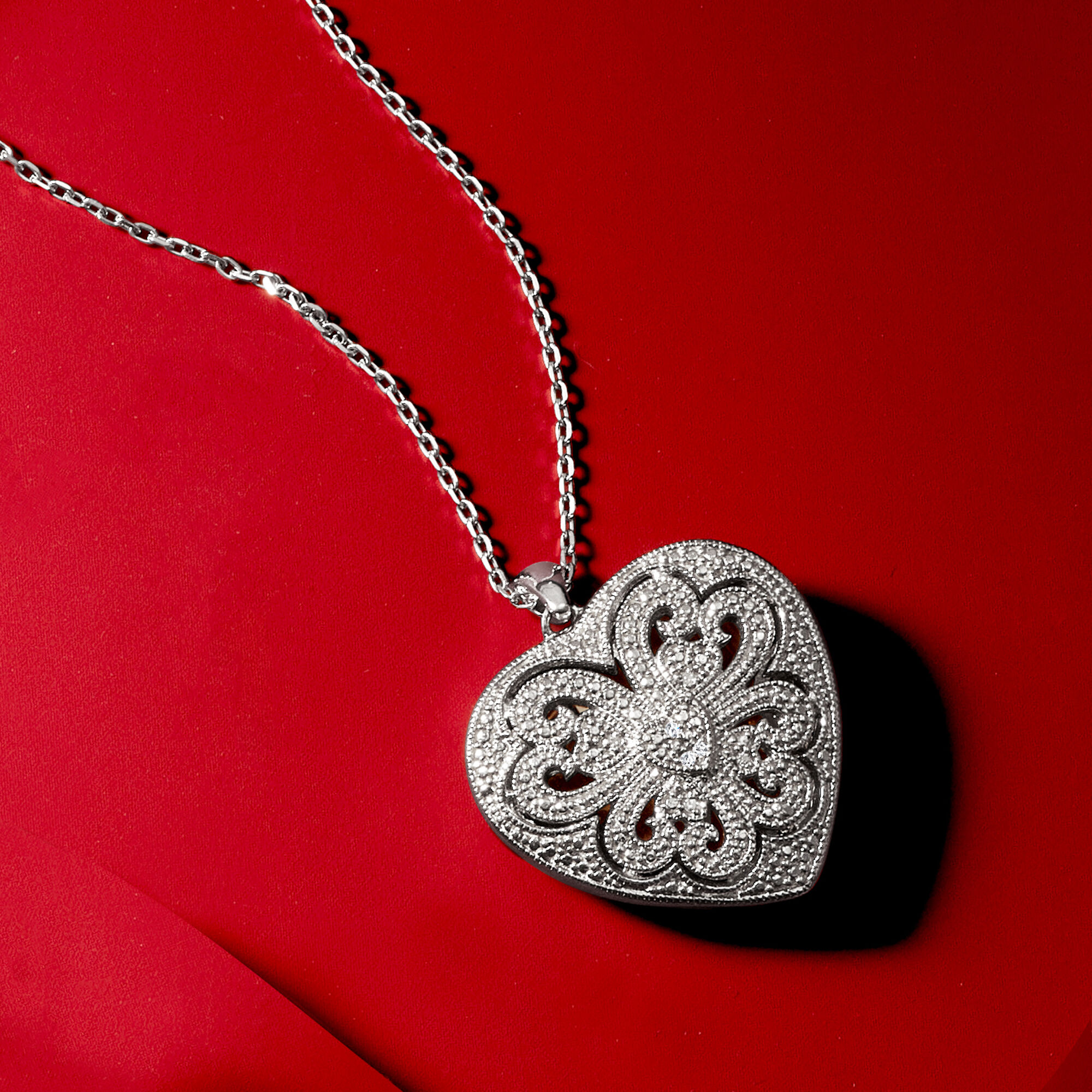 Sterling Silver Scrolled Heart Locket Necklace with Diamond Accents. 16