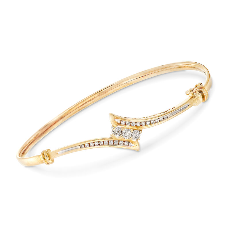C. 1990 Vintage .55 ct. t.w. Diamond Bypass Bangle Bracelet in 14kt Yellow Gold. 7&quot; image number 0