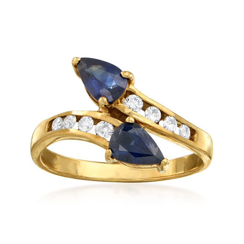 C. 1980 Vintage .95 ct. t.w. Sapphire and .20 ct. t.w. Diamond Bypass Ring in 14kt Yellow Gold image number 0