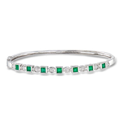 C. 1980 Vintage 1.05 ct. t.w. Emerald and .35 ct. t.w. Diamond Bangle Bracelet in 14kt White Gold