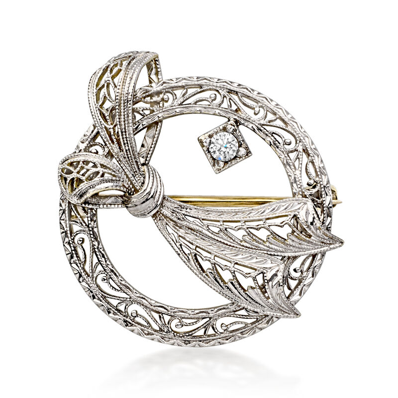C. 1980 Vintage Platinum and 14kt Yellow Gold Openwork Bow Pin with Single Diamond  image number 0