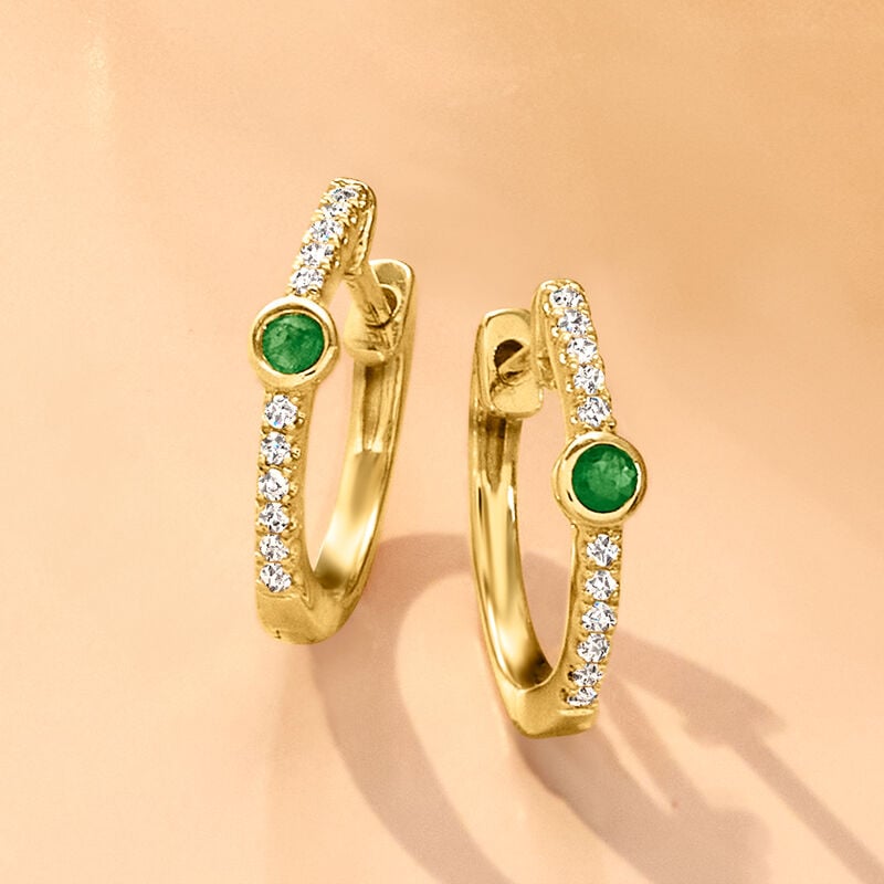 Emerald and Diamond Huggie Hoop Earrings in 14kt Yellow Gold. 3/8" image number 1
