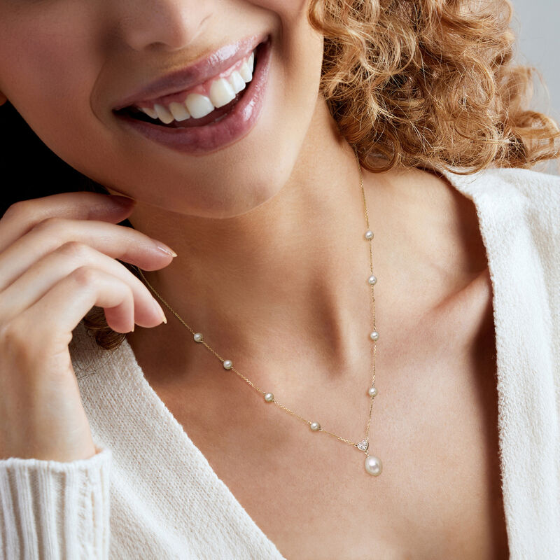 C. 1990 Vintage 4.5-11x8mm Cultured Pearl Station Necklace with Diamond Heart in 14kt Yellow Gold. 20" image number 1