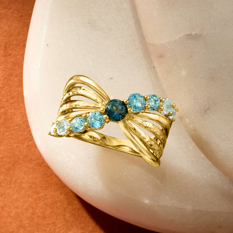 1.20 ct. t.w. Tonal Blue Topaz Bow Ring in 18kt Gold Over Sterling image number 3