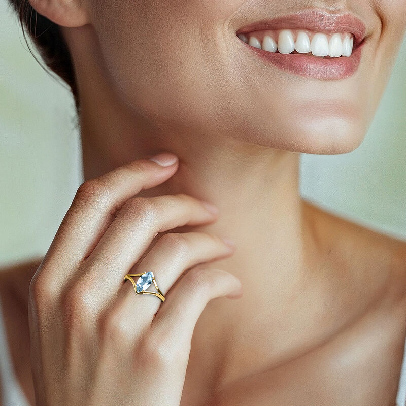 1.20 Carat Marquise Sky Blue Topaz Ring in 10kt Yellow Gold image number 1