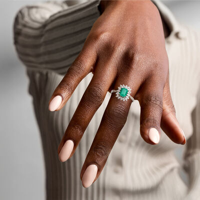 C. 1990 Vintage 1.27 Carat Emerald and .11 ct. t.w. Diamond Ring in Platinum