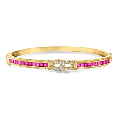 C. 1990 Vintage 2.40 ct. t.w. Ruby and .10 ct. t.w. Diamond Bangle Bracelet in 14kt Yellow Gold