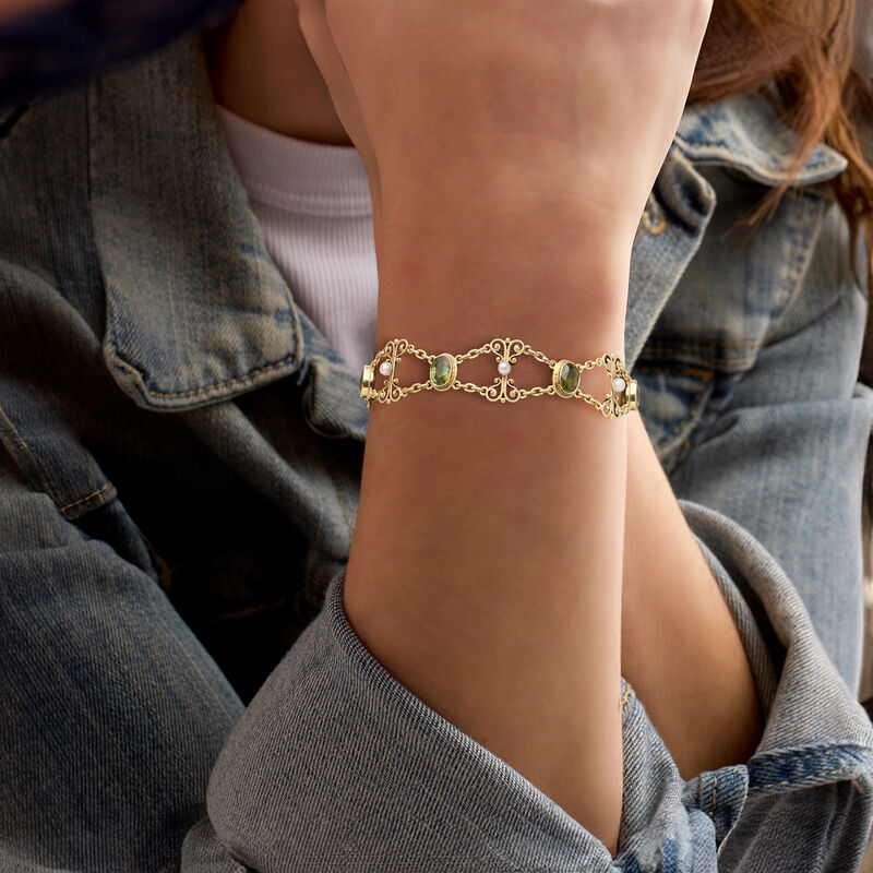 C. 1970 Vintage 5.25 ct. t.w. Peridot and 3mm Cultured Pearl Scroll Bracelet in 18kt Yellow Gold. 7.25&quot; image number 1
